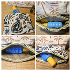 Trousse isotherme contenant une crème solaire posée sur un meuble. Montre les differents angle de l'intérieur de la pochette fait main par la créatrice de Mon fil à passion 